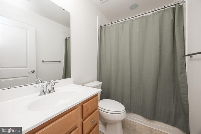 full bathroom with toilet, a shower with curtain, tile patterned flooring, and vanity