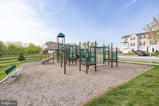 communal playground featuring fence