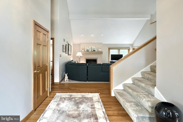 6 Pond Ridge Ln, Hanover, PA 17331 - entryway with a fireplace, stairs, wood finished floors, high vaulted ceiling, and baseboards