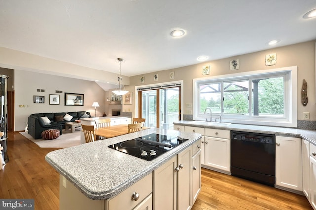 6 Pond Ridge Ln, Hanover, PA 17331 - kitchen featuring black appliances, a sink, a center island, open floor plan, and light wood-style flooring
