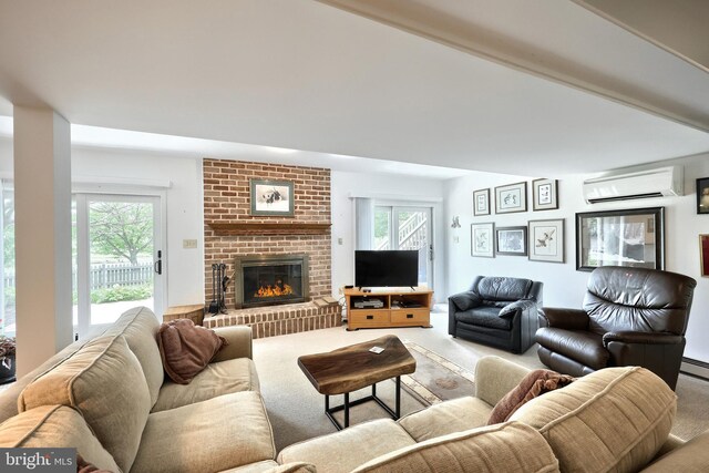 6 Pond Ridge Ln, Hanover, PA 17331 - living room with a wall mounted AC, carpet, a brick fireplace, and healthy amount of natural light