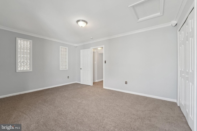 7113 Carriage Hill Dr, Laurel, MD 20707 - unfurnished bedroom with a closet, ornamental molding, attic access, carpet flooring, and baseboards
