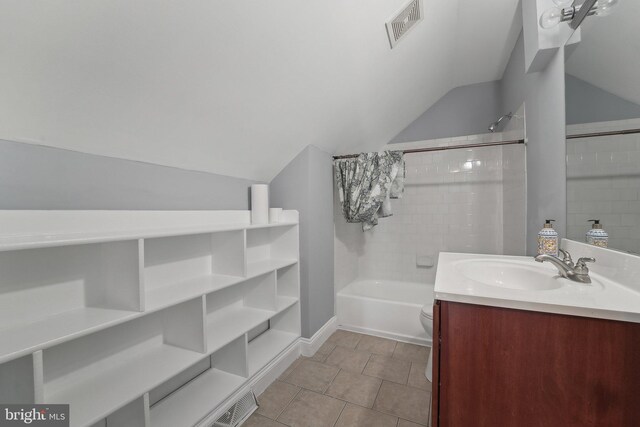 7113 Carriage Hill Dr, Laurel, MD 20707 - full bathroom featuring visible vents, vanity, tile patterned flooring, and vaulted ceiling