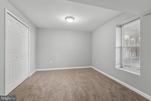 7113 Carriage Hill Dr, Laurel, MD 20707 - unfurnished bedroom with carpet, a closet, and baseboards
