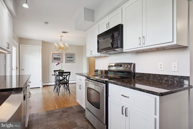 26105 Cornor Dr, Damascus, MD 20872 - kitchen with black microwave, stainless steel range with electric stovetop, a chandelier, white cabinetry, and a baseboard heating unit