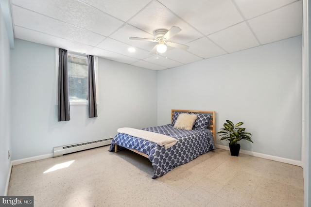 26105 Cornor Dr, Damascus, MD 20872 - bedroom with a baseboard radiator, baseboards, a paneled ceiling, and ceiling fan
