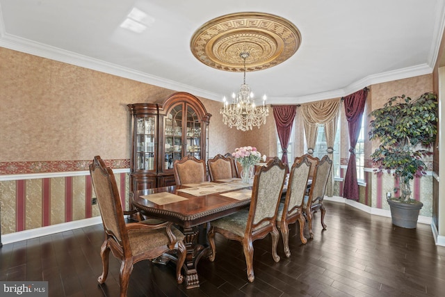 dining room with an inviting chandelier, baseboards, wallpapered walls, wood finished floors, and ornamental molding