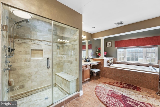 bathroom with a garden tub, visible vents, ornate columns, tile patterned floors, and a shower stall