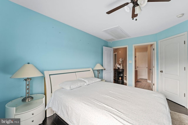 bedroom featuring ceiling fan and attic access