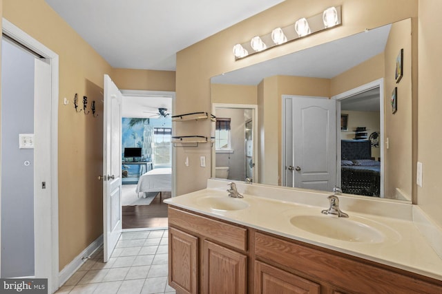 full bath featuring ensuite bathroom, a sink, and double vanity