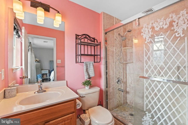 ensuite bathroom with ensuite bath, vanity, toilet, a shower stall, and visible vents
