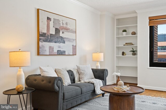1077 30th St NW Unit 612, Washington, DC 20007 - living room featuring baseboards, crown molding, built in shelves, and a textured ceiling