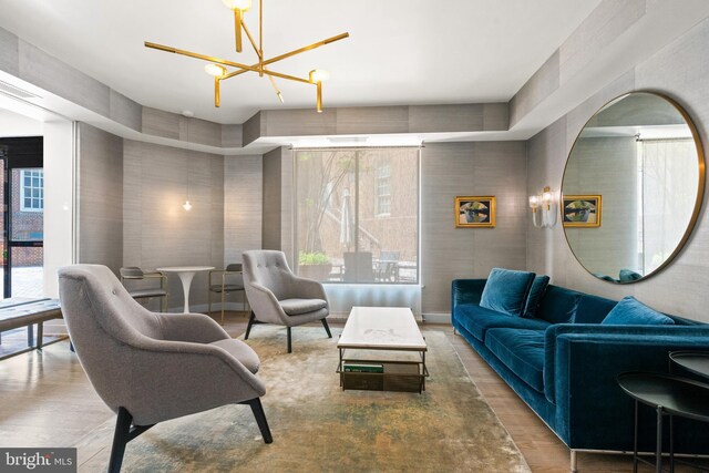 1077 30th St NW Unit 612, Washington, DC 20007 - living room with a chandelier and wood finished floors