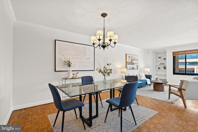 1077 30th St NW Unit 612, Washington, DC 20007 - dining room with a textured ceiling, a chandelier, built in shelves, crown molding, and baseboards