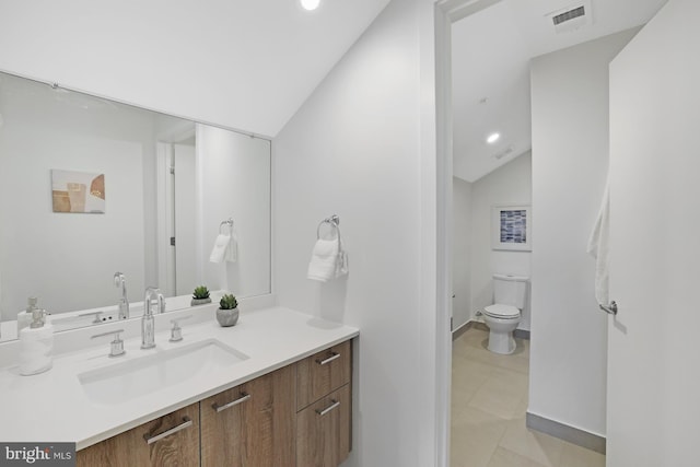 515 N Washington St Unit 404, Alexandria, VA 22314 - bathroom featuring visible vents, vanity, toilet, lofted ceiling, and recessed lighting