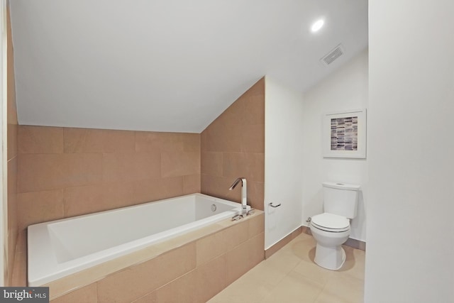 515 N Washington St Unit 404, Alexandria, VA 22314 - full bathroom with visible vents, toilet, baseboards, a bath, and vaulted ceiling