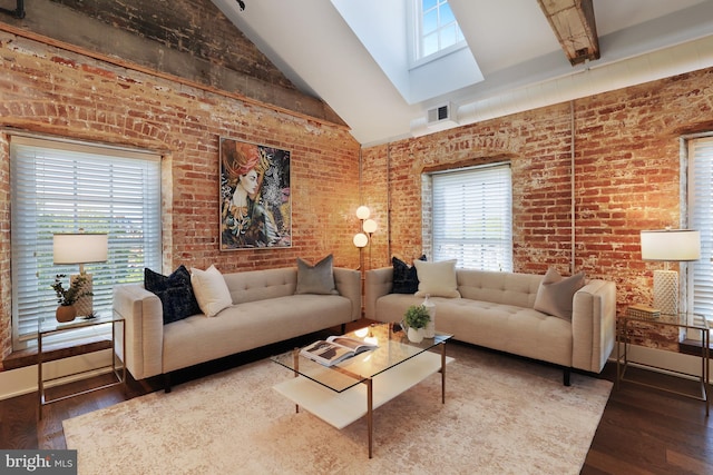 515 N Washington St Unit 404, Alexandria, VA 22314 - living room featuring brick wall, wood finished floors, a healthy amount of sunlight, and high vaulted ceiling