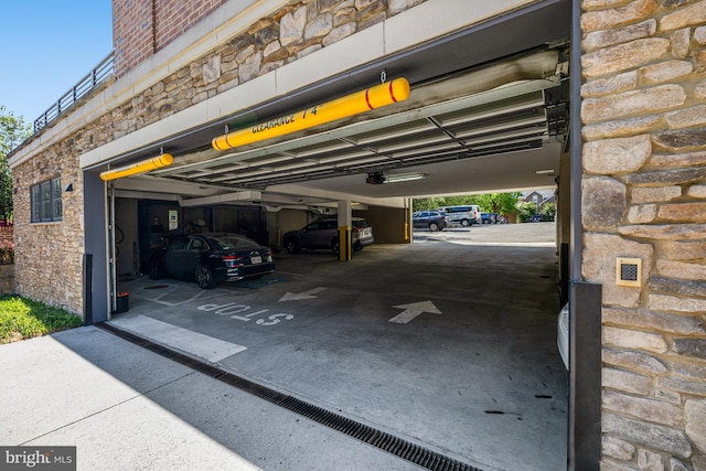 515 N Washington St Unit 404, Alexandria, VA 22314 - parking deck featuring a garage door opener