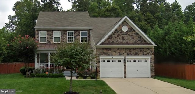 17202 Madrillon Way, Accokeek, MD 20607 - view of front of home with stone siding, driveway, a standing seam roof, and a garage