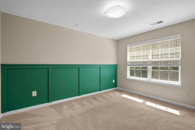 17202 Madrillon Way, Accokeek, MD 20607 - empty room featuring carpet, wainscoting, and a decorative wall