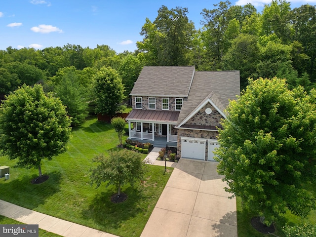 17202 Madrillon Way, Accokeek, MD 20607 - view of front of property featuring covered porch, stone siding, driveway, a front lawn, and a standing seam roof