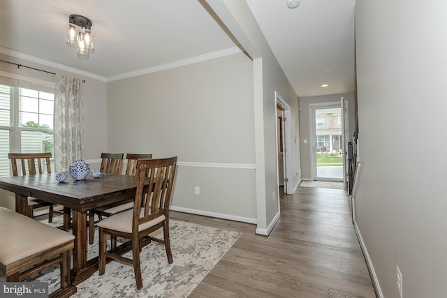 7928 Meridian Dr, Pasadena, MD 21122 - dining room with baseboards, light wood finished floors, and ornamental molding