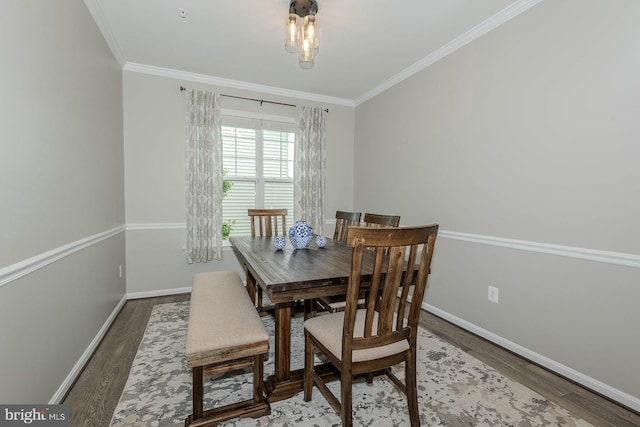 7928 Meridian Dr, Pasadena, MD 21122 - dining room with wood finished floors, crown molding, and baseboards