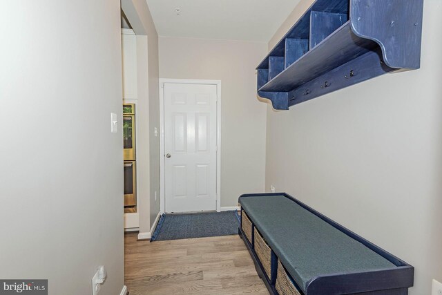 7928 Meridian Dr, Pasadena, MD 21122 - mudroom with wood finished floors and baseboards