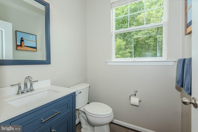 7928 Meridian Dr, Pasadena, MD 21122 - bathroom with toilet, vanity, and baseboards