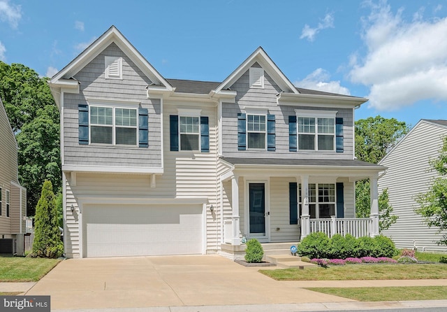 7928 Meridian Dr, Pasadena, MD 21122 - view of front of home featuring covered porch, concrete driveway, and a garage