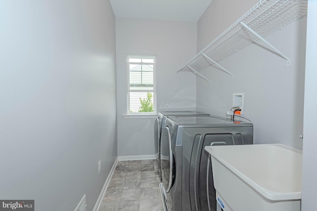 7928 Meridian Dr, Pasadena, MD 21122 - washroom featuring independent washer and dryer, light marble finish floors, and baseboards