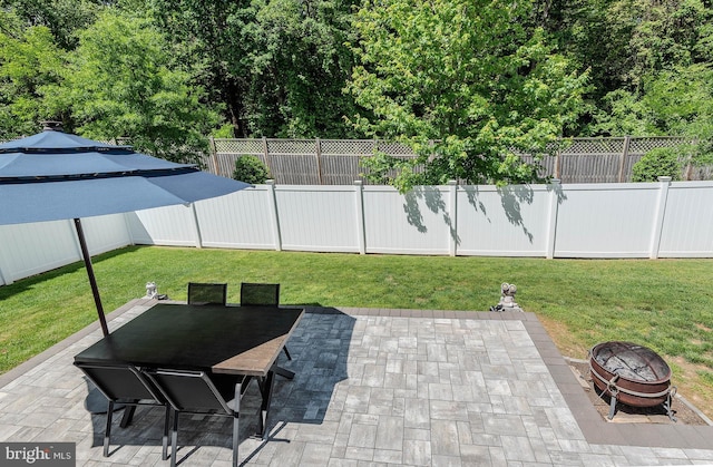 7928 Meridian Dr, Pasadena, MD 21122 - view of patio featuring a fire pit