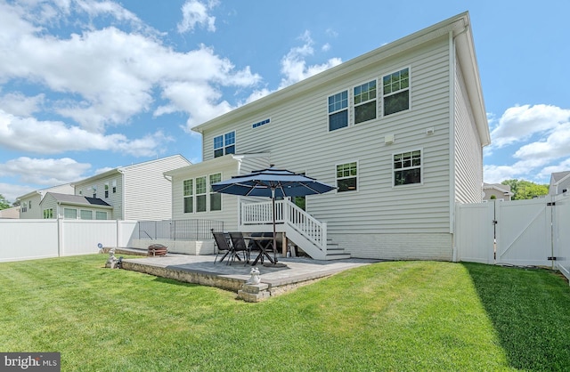 7928 Meridian Dr, Pasadena, MD 21122 - rear view of property featuring a gate and a patio