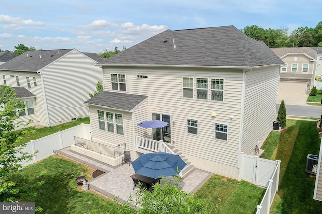 7928 Meridian Dr, Pasadena, MD 21122 - back of house featuring a gate, a patio, a deck, cooling unit, and a shingled roof