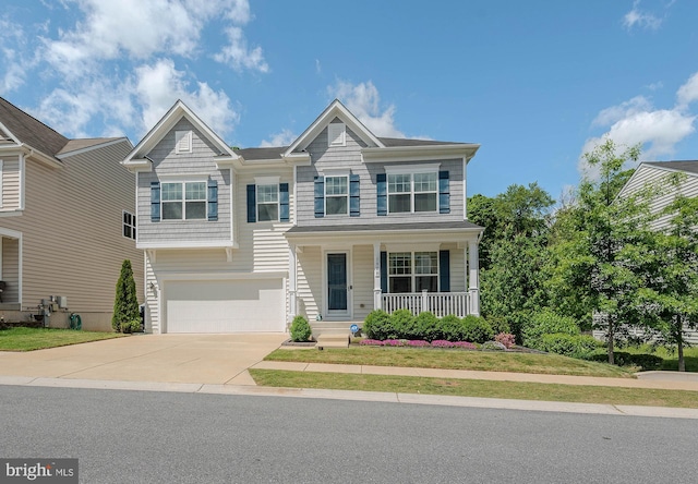 7928 Meridian Dr, Pasadena, MD 21122 - view of front of property with covered porch, concrete driveway, and an attached garage