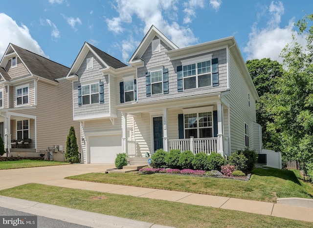 7928 Meridian Dr, Pasadena, MD 21122 - view of front of property with a porch, concrete driveway, an attached garage, and a front lawn