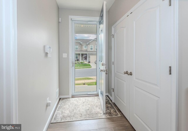 7928 Meridian Dr, Pasadena, MD 21122 - entryway featuring wood finished floors and baseboards