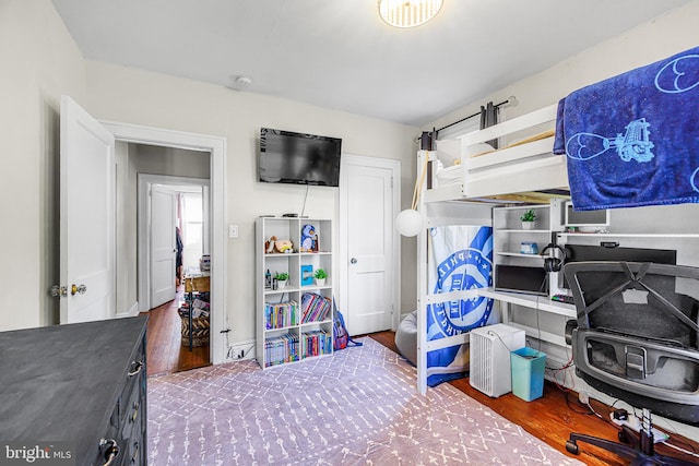 bedroom featuring wood finished floors
