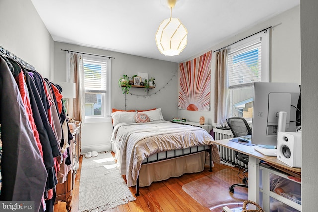 bedroom featuring wood finished floors