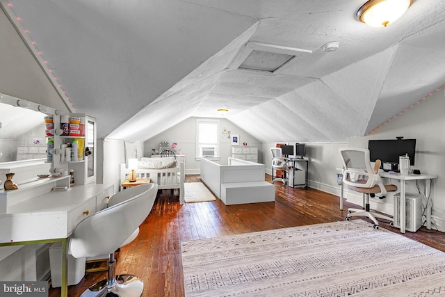 office area with baseboards, wood-type flooring, and lofted ceiling