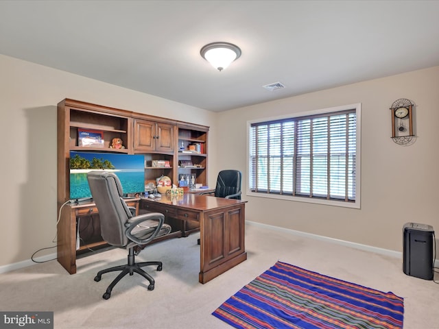 carpeted home office featuring baseboards and visible vents