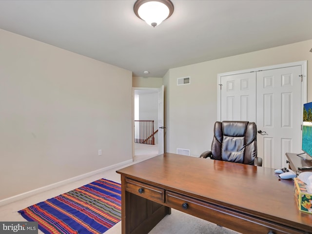 home office featuring baseboards and visible vents