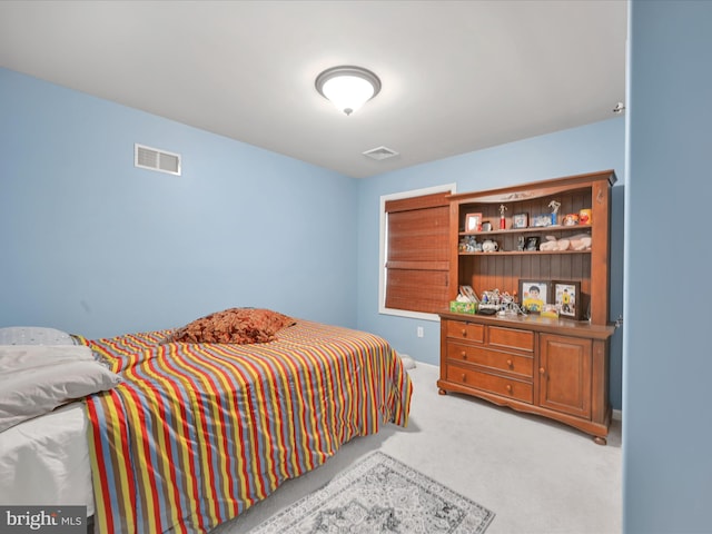 bedroom with carpet flooring and visible vents