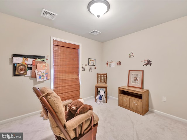 sitting room with light colored carpet, baseboards, and visible vents