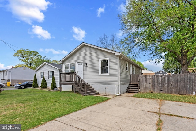 722 210th St, Pasadena, MD 21122 - view of front of property with fence and a front yard