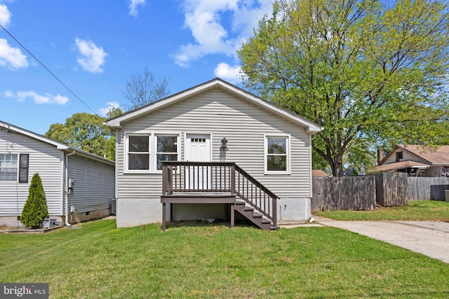 722 210th St, Pasadena, MD 21122 - view of front of house featuring fence and a front yard