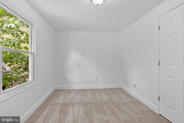 722 210th St, Pasadena, MD 21122 - empty room with a healthy amount of sunlight, baseboards, and light carpet