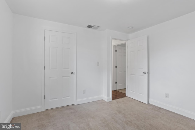 722 210th St, Pasadena, MD 21122 - unfurnished bedroom featuring visible vents, carpet flooring, and baseboards