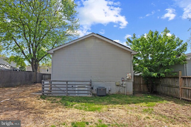 722 210th St, Pasadena, MD 21122 - view of property exterior with a fenced backyard and central AC