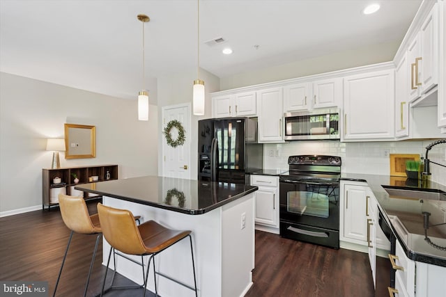 324 Jefferson Ave Unit 25, Downingtown, PA 19335 - kitchen featuring dark wood-style flooring, visible vents, a sink, and black appliances